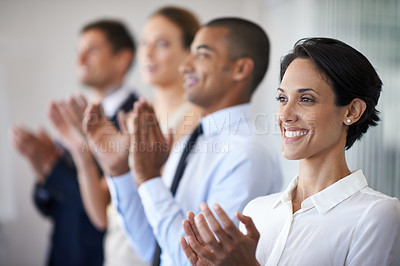 Buy stock photo Shot of a row of smiling colleagues clapping
