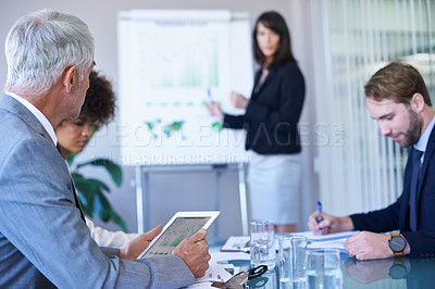 Buy stock photo Businesswoman, presentation and conference room with graphs for teamwork report or growth, development or charts. Female person, colleagues and company strategy or finance sales, meeting or tablet