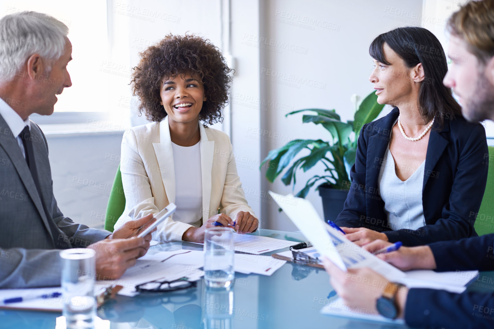 Buy stock photo Business people, teamwork and meeting with documents in office for financial planning, brainstorming and diversity. Professional, employees and collaboration in boardroom with strategy and happiness