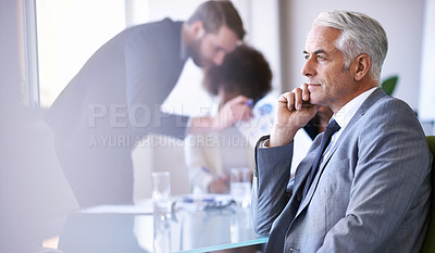 Buy stock photo Cropped shot of a group of business colleagues meeting in the boardroom