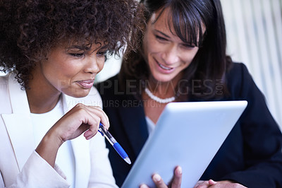 Buy stock photo Cropped shot of two businesswoman working together