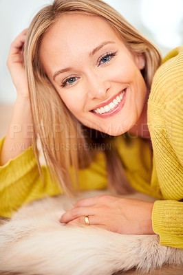 Buy stock photo A beautiful young woman lying on the floor at home
