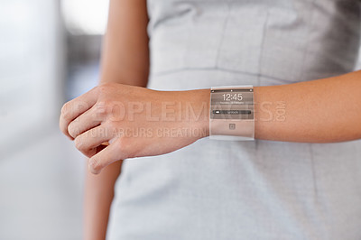 Buy stock photo Cropped view of a woman wearing a smartwatch