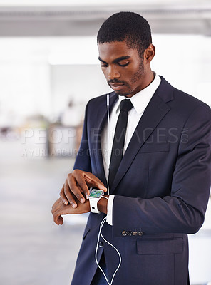 Buy stock photo Cropped view of a young businessman wearing a smartwatch with a digital interface - All screen content is designed by us and not copyrighted by others