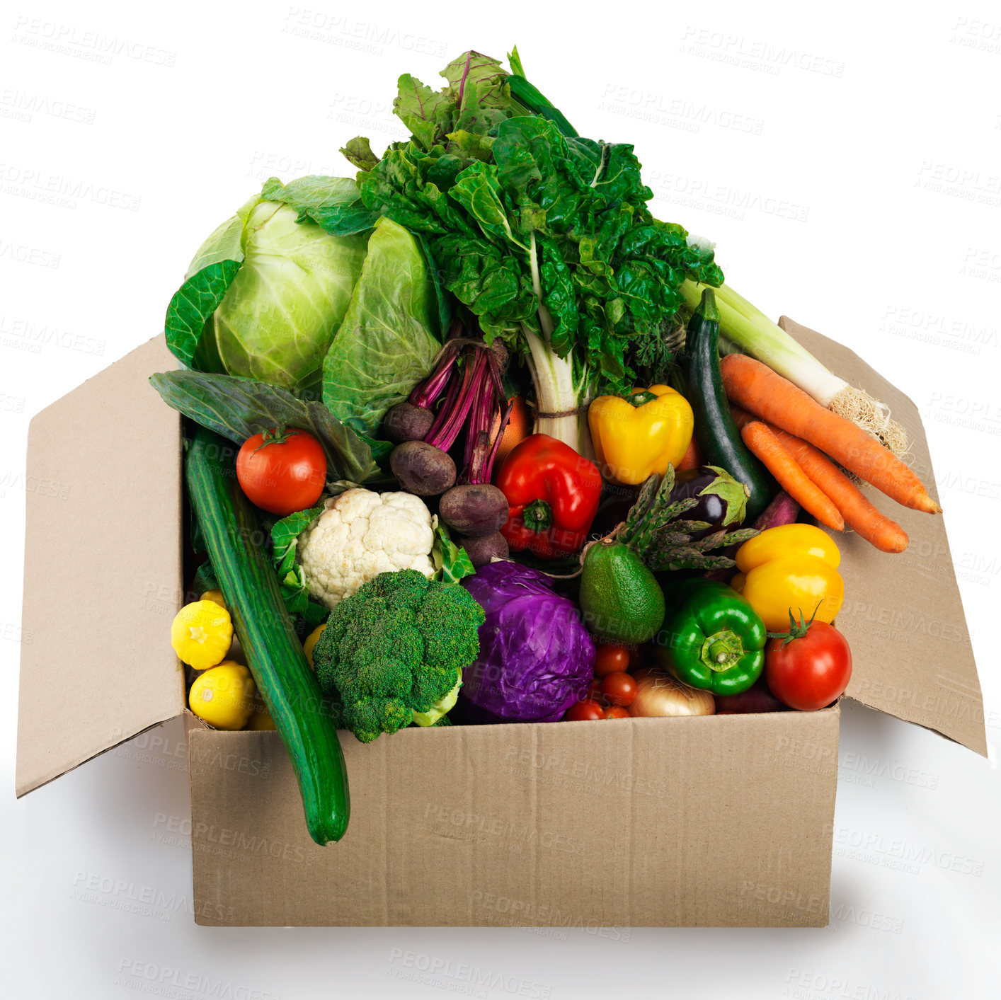 Buy stock photo Studio shot of a cardboard box filled with fruit and vegetables