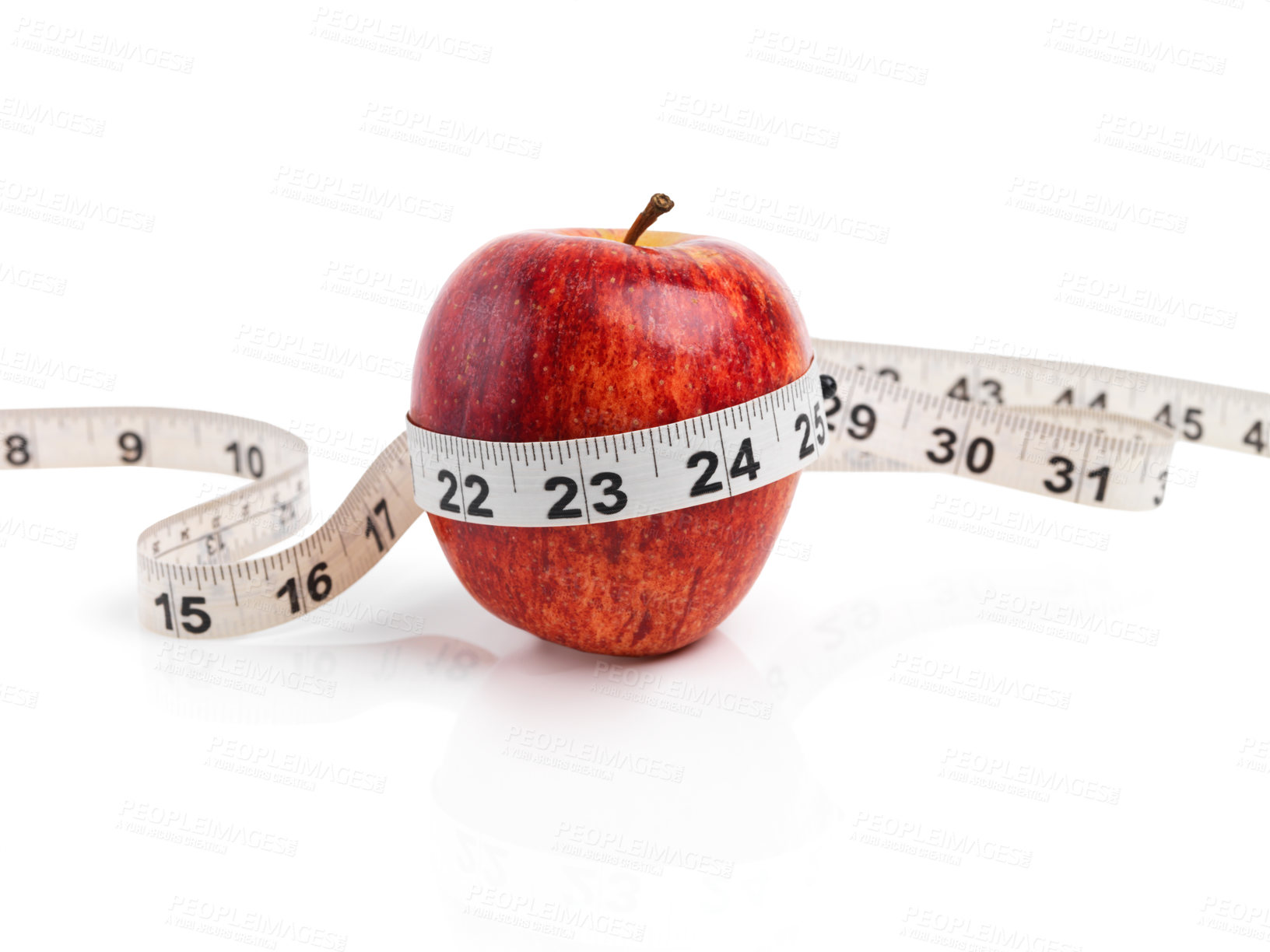 Buy stock photo Apple, wellness and measuring tape with red fruit in studio isolated on white background for diet, health or nutrition. Sustainability, size and minerals with organic produce for detox or weightloss