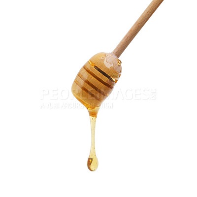 Buy stock photo Shot of a honey dipper dripping delicious honey