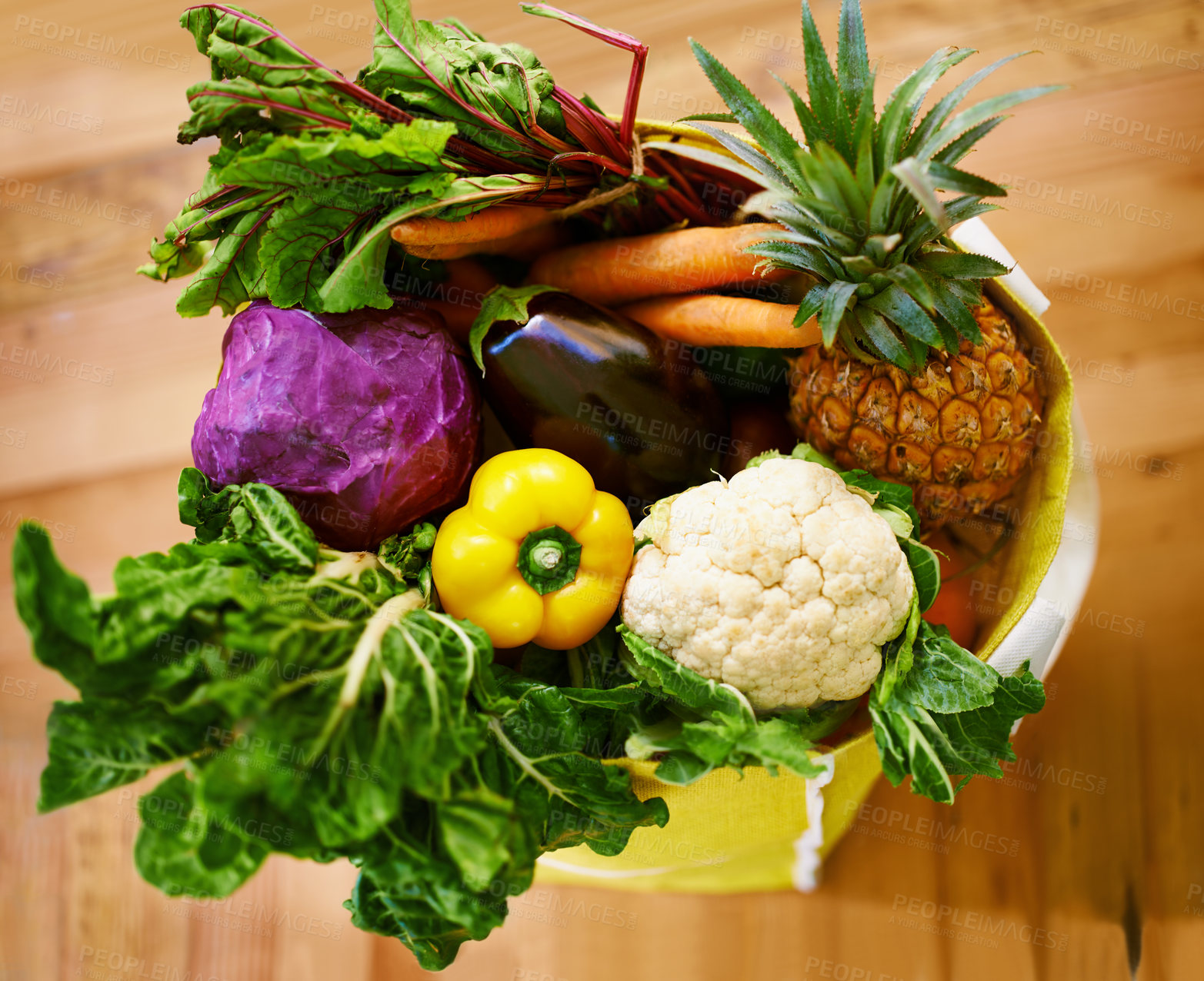 Buy stock photo Shot of an assortment of fruit and vegetables in a shopping bag