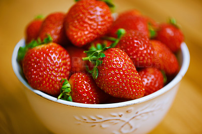 Buy stock photo Kitchen counter, bowl and strawberry for healthy or nutrition on diet with ingredient for juice and milkshake. Closeup, fruit and sweet flavor for snack or lunch with fresh food for self care.