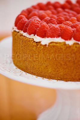 Buy stock photo Plate, cream and cheesecake with raspberries on table for sweet snack for tea time at home. Bakery, catering and closeup of gourmet dessert with crust, frosting and fresh organic fruit in dining room