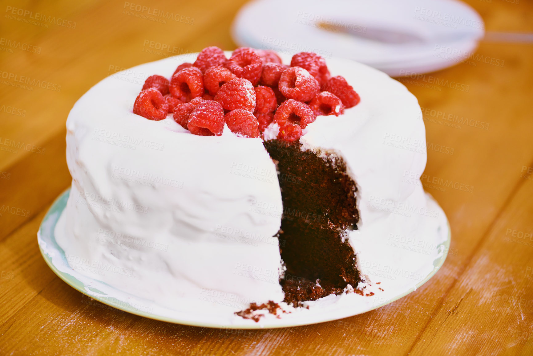 Buy stock photo Chocolate, dessert and blackforest cake for bakery, raspberries and sweet snack for eating. Fruit, icing and plate  for display on table in restaurant, creamy and baked confection with berries