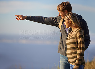 Buy stock photo Couple, mountain and hike for pointing on travel, love and together on vacation or holiday.  People, outdoor date and view on weekend adventure, bonding and sightseeing journey of sea on mockup space