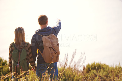 Buy stock photo Rear view shot of a happy couple out on a hike together