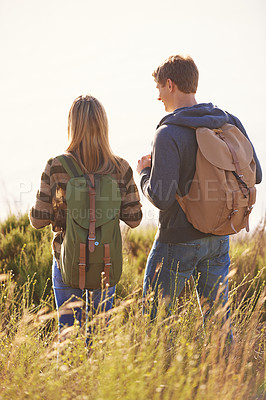 Buy stock photo Spring, backpack and couple in nature, adventure and bonding for holiday, vacation and trip to Amsterdam. Outdoor, man and woman together for love in field for hiking of girl and male person