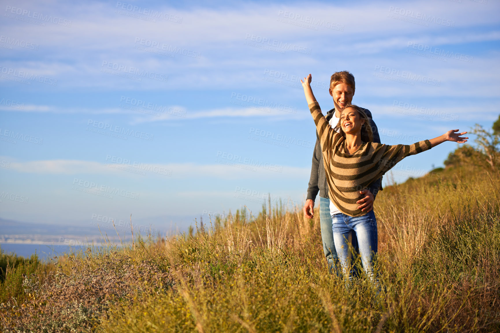 Buy stock photo Spring, freedom and couple in nature, happy and bonding for holiday, vacation and trip to Amsterdam. Outdoor, man and woman together for love in field for anniversary of girl and male person