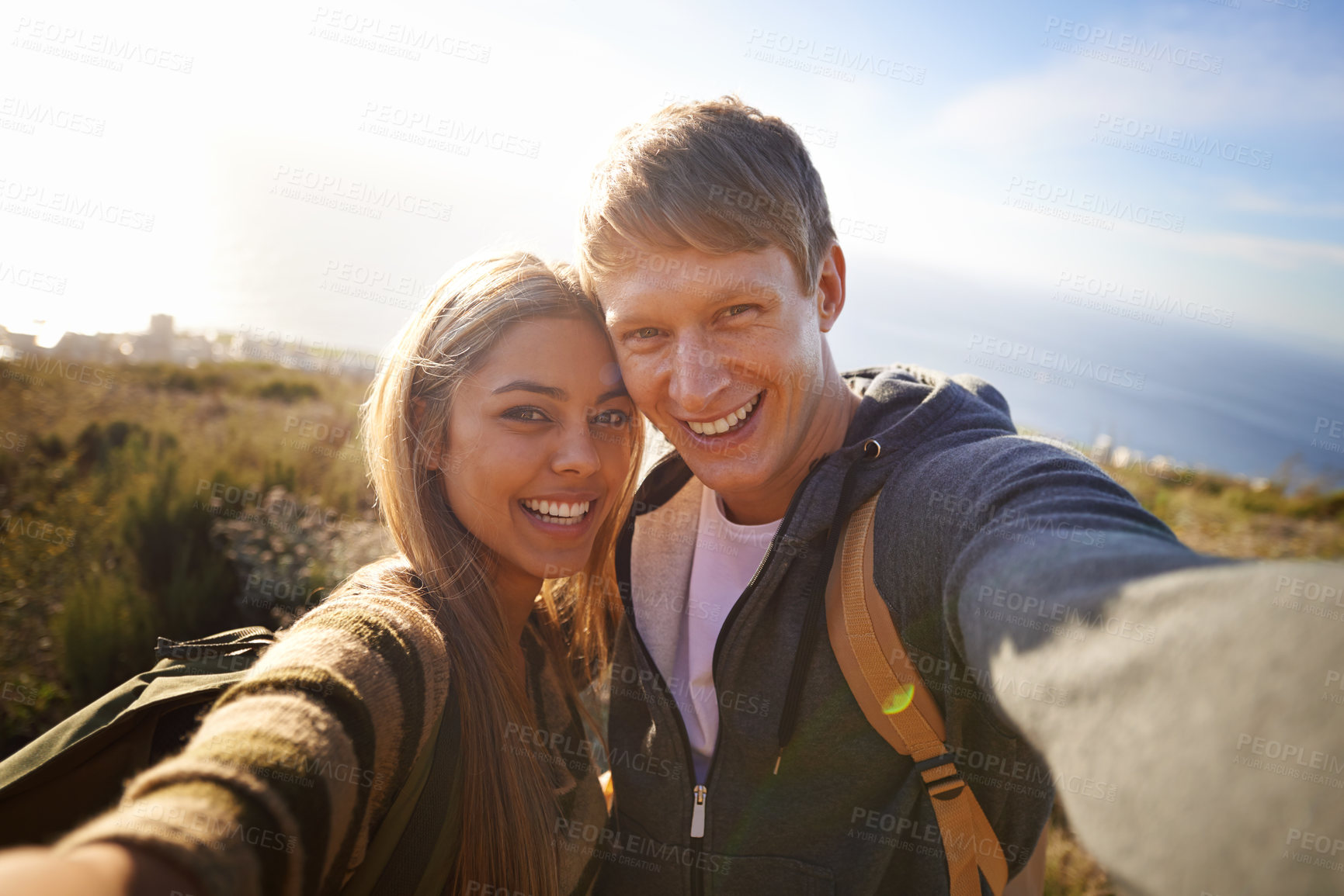 Buy stock photo Portrait of a happy young couple out for a hike