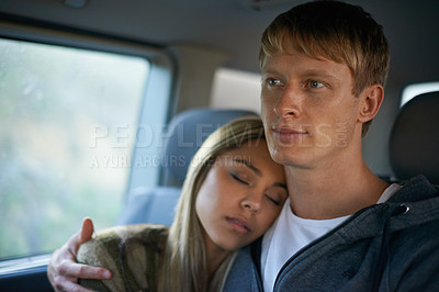 Buy stock photo Car, love and couple hug in a taxi for travel, journey or bonding on road trip together. Cab, commute or people embrace on backseat with support, safety or care while sleeping in chauffeur transport