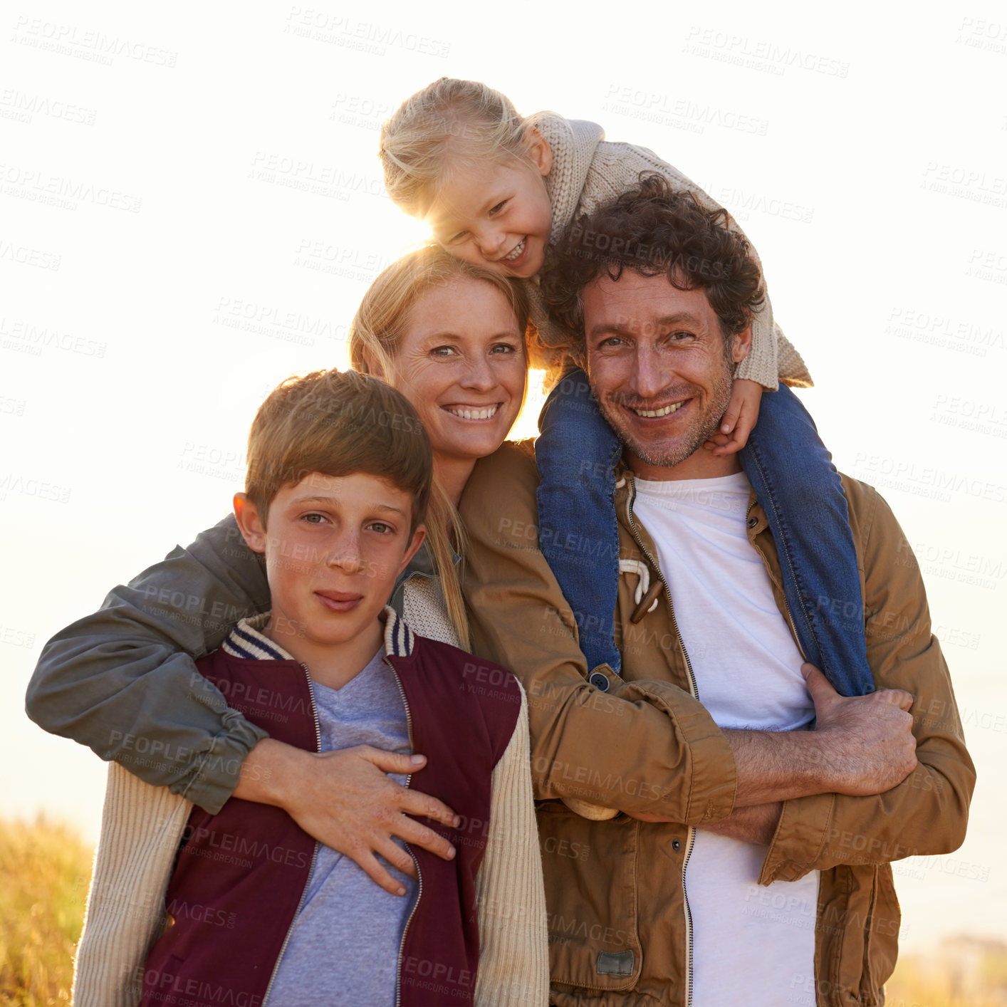 Buy stock photo Portrait of a happy family out on a morning walk together