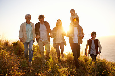 Buy stock photo Shot of a happy family out on a morning walk together