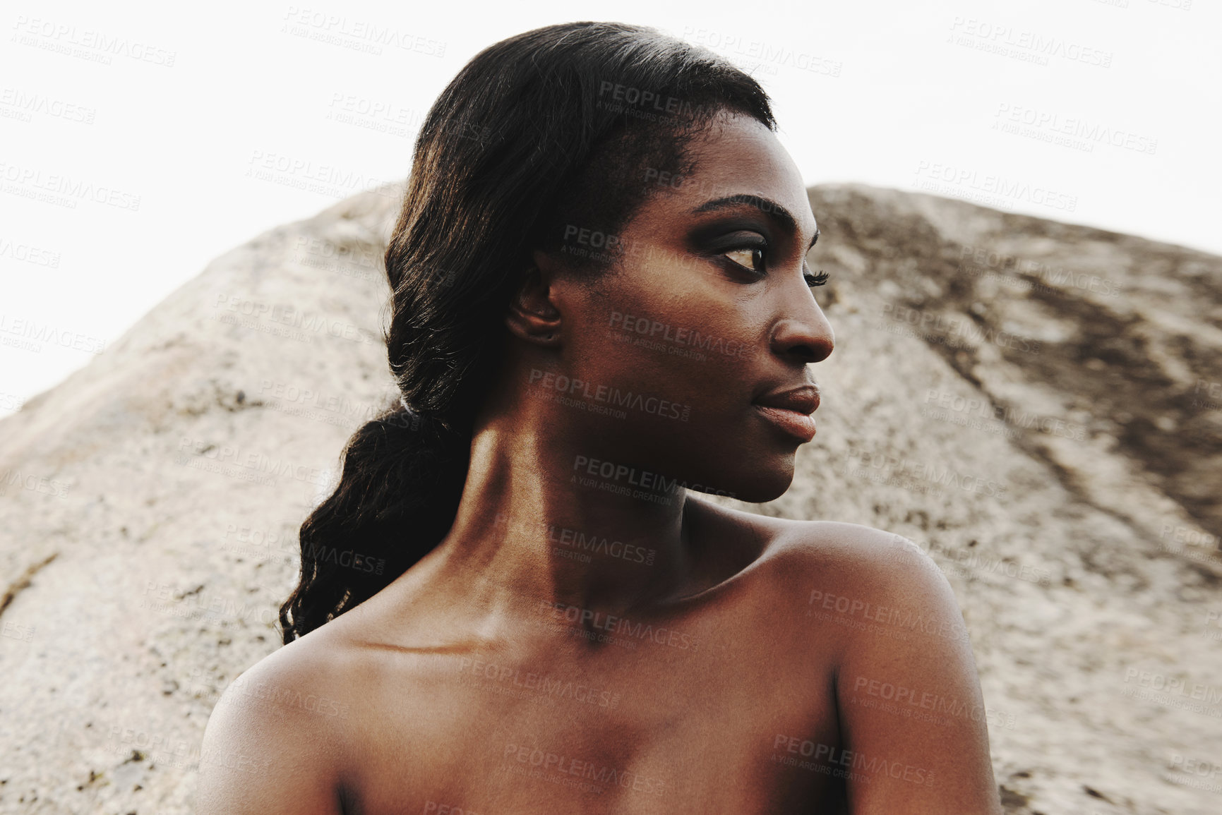 Buy stock photo Cropped shot of an attractive woman posing on the beach