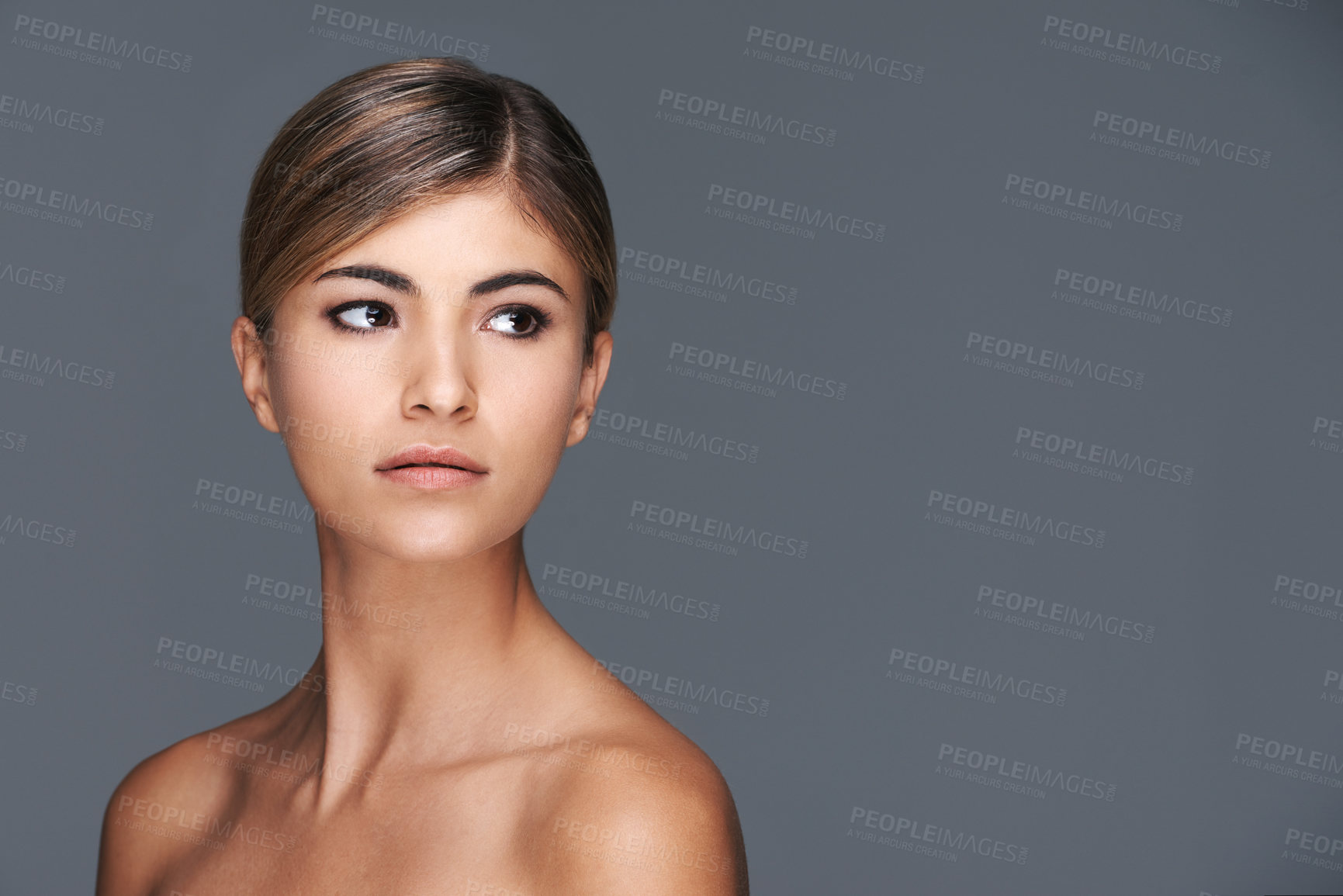 Buy stock photo Beauty, space and thinking with natural woman in studio isolated on grey background for wellness. Aesthetic, skincare and vision with confident young model on mockup for dermatology treatment