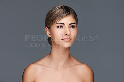 Buy stock photo Cropped shot of a beautiful young woman with flawless skin isolated on gray
