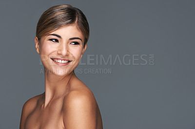 Buy stock photo Beauty, smile and thinking with natural woman in studio isolated on blue background for wellness. Aesthetic, skincare and vision with happy young model on mockup space for dermatology treatment