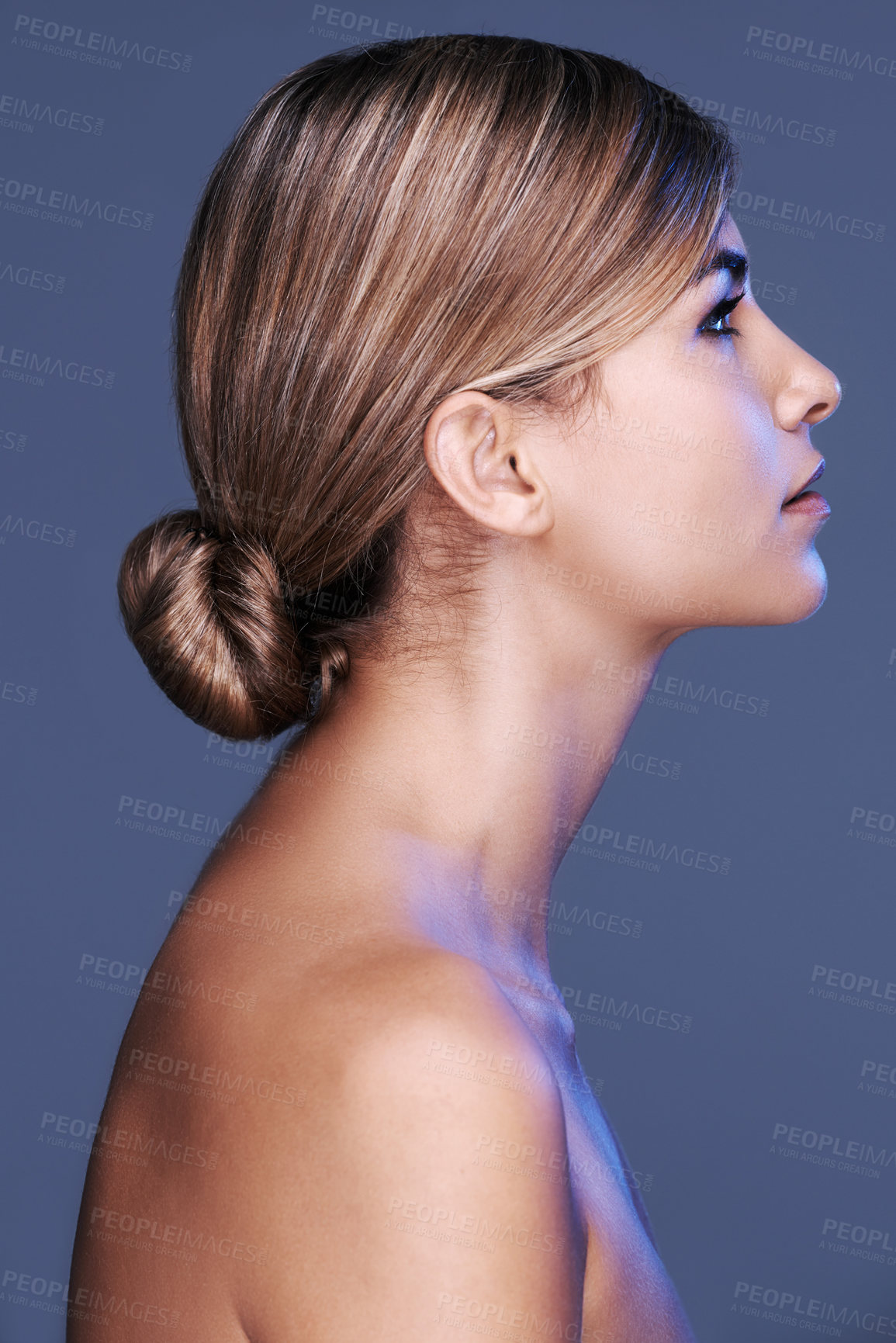 Buy stock photo A cropped profile of a beautiful young woman isolated on grey