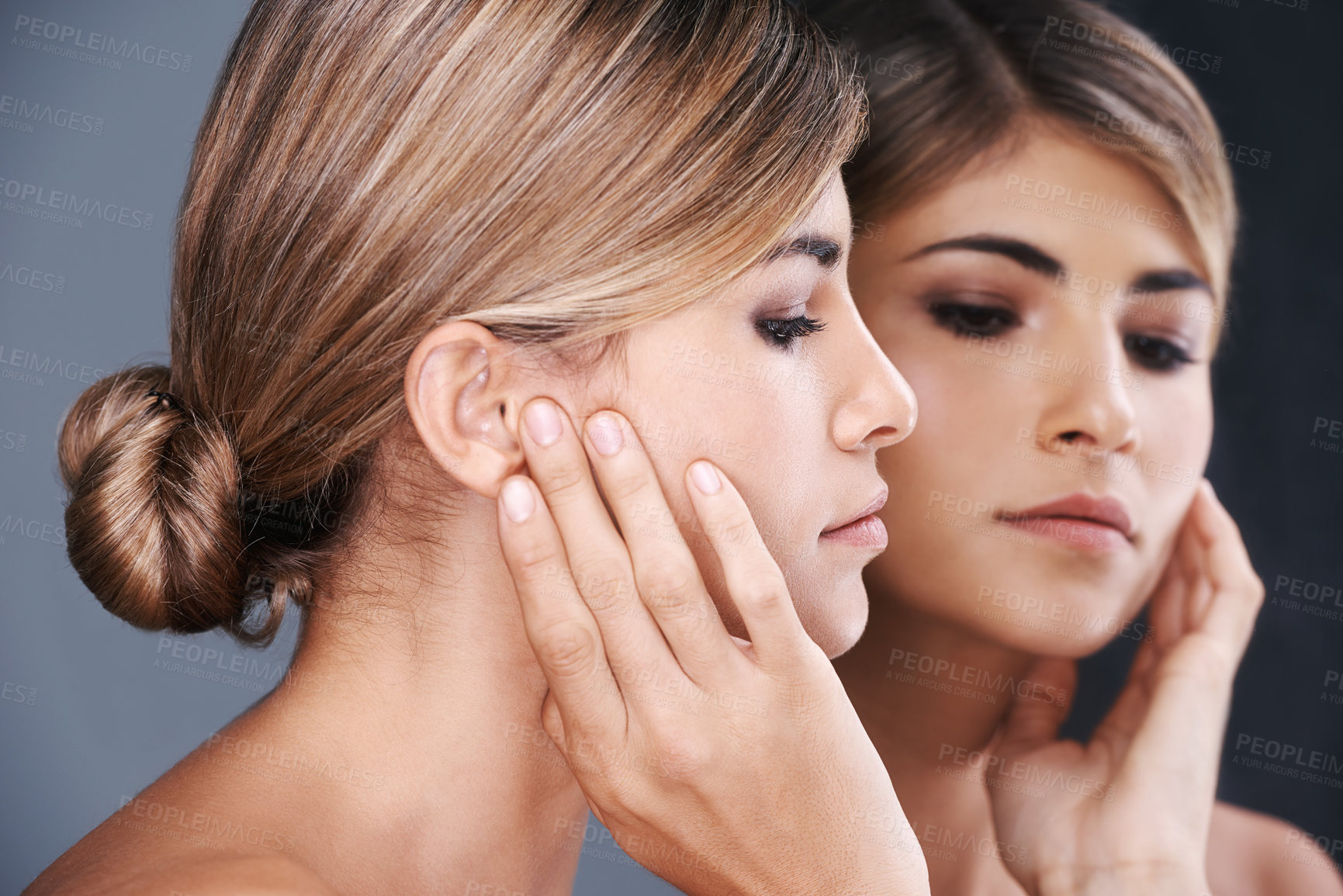 Buy stock photo Beauty, facial and mirror with natural woman in studio isolated on blue background for wellness. Aesthetic, face and skincare with reflection of confident young model at spa for cosmetic dermatology