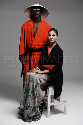 Buy stock photo Studio fashion shot of a man and woman wearing oriental-style clothing