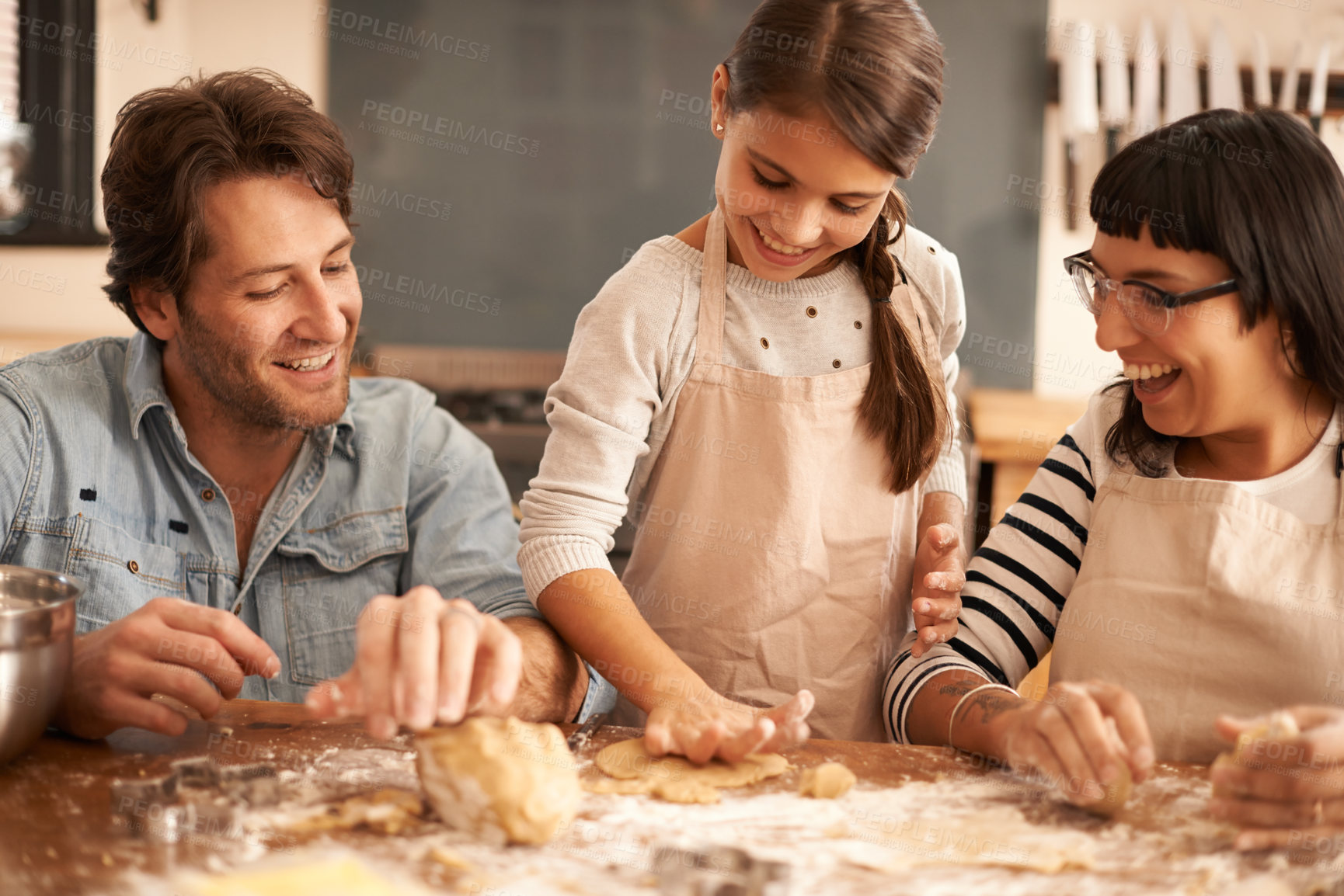 Buy stock photo Mother, father and girl with dough for cooking in kitchen with flour, happiness and teaching with support. Family, parents and child with helping, learning and bonding with baking for snack and hobby