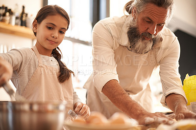 Buy stock photo Girl, child and grandfather with baking in kitchen for cooking, cookies and teaching with support or helping. Family, senior man and grandchild with dough preparation in home for bonding and learning