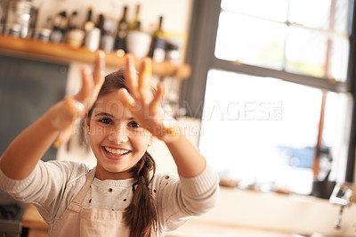 Buy stock photo Girl, portrait and hands for baking in kitchen, pastry and happy for food preparation in home. Female person, kid and smile for learning in home, child development and education for skills or cake