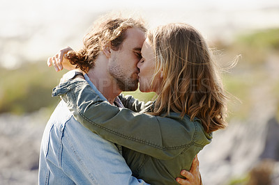 Buy stock photo Caring, couple and kissing or hug on mountain, nature and scenery with passionate people in relationship. Love, care and embrace on romantic date, vacation or holiday in Sweden together in summer
