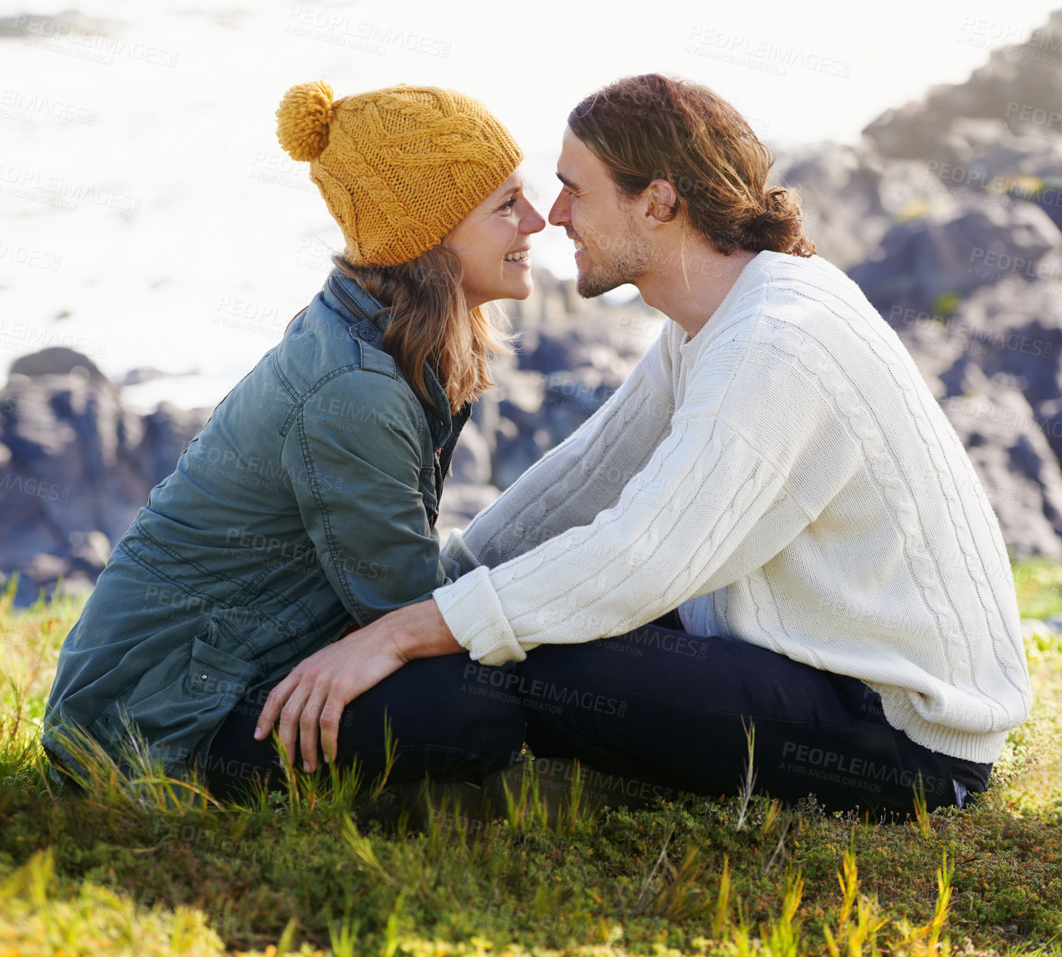 Buy stock photo Happy, couple and together in nature or sitting on grass, hilltop and scenery or people looking with love. Care, smile and romantic date on winter vacation, holiday and relationship in Sweden
