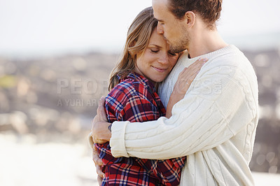 Buy stock photo Hug, date and couple with love, beach and happiness with weekend break and vacation for honeymoon. Outdoor, travel and embrace with woman and man with sunshine and summer with holiday, kiss or nature
