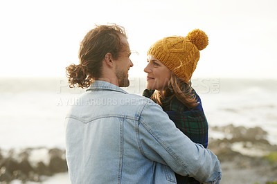 Buy stock photo Hug, beach and couple with love, travel and happiness with weekend break and vacation for honeymoon. Outdoor, journey and embrace with woman and man with sunshine and summer with holiday or adventure