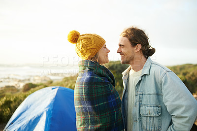 Buy stock photo Happy couple, camping and bonding together in outdoor, blanket and romantic getaway to relax by tent. Man, woman and love on vacation for honeymoon break, adventure and travel for marriage in nature