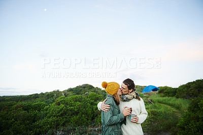 Buy stock photo Camping, nature and couple with love, kiss and smile with happiness and holiday for honeymoon. Romance, travel or man with woman or embrace with vacation or bonding together with adventure or journey