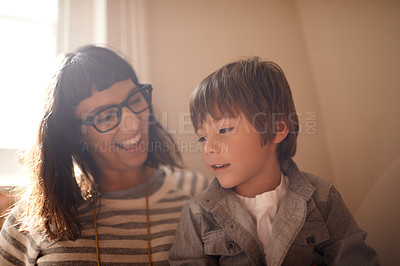 Buy stock photo Home, relax and family with mother, son and conversation with happiness and bonding together. Single parent, son and kid with mama and discussion with joke and funny with humor, smile and laughing