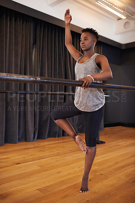Buy stock photo Ballerina, dancer and black woman stretching in studio for balance, wellness and theatre performance. Creative dance, fitness and person do ballet movement for exercise, training and art practice