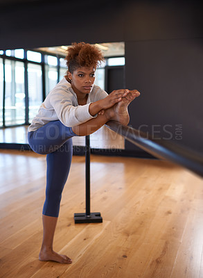 Buy stock photo Shot of an attractive young woman practicing in a dance studio