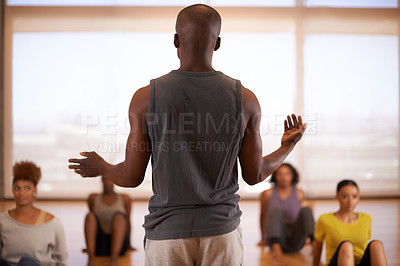 Buy stock photo People, dancer and instructor with class of students in fitness, workout or pilates at the studio. Rear view of personal trainer talking to group in body warm up or stretching for health and wellness