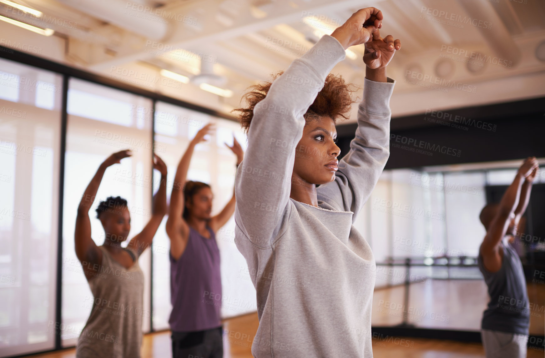 Buy stock photo Woman, dancer and personal trainer with class for stretching, workout or exercise at studio. Young female person or coach training people for dancing, body warm up or practice in health and wellness