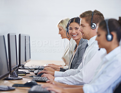 Buy stock photo Help desk, phone call and portrait of woman in row typing on computer at customer support. Headset, telemarketing and client service agent at callcenter for consultation, teamwork and smile in office