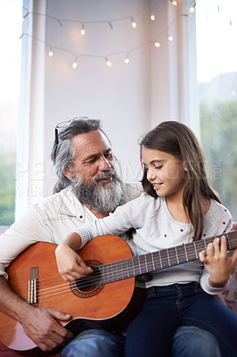 Buy stock photo Mature man, girl or guitar as learning, music or training as creative practice for skill development. Retired teacher, student or instrument to mentor, guide or advice as song, bonding or together