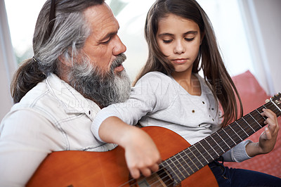 Buy stock photo Music, guitar and grandfather teaching girl to play, help with creativity, learning and creative development. Musician, senior man helping female kid learn focus and skill on musical instrument