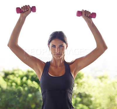 Buy stock photo Outdoor, woman and workout with dumbbell to exercise for healthy living or fitness, confident and focus. Portrait, female person and weights for gym or training with wellbeing and self care. 