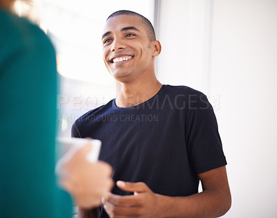Buy stock photo Cropped shot of casually dressed colleagues chatting over work
