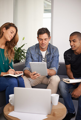 Buy stock photo University, students and technology on sofa for project research, brainstorming or email feedback. College, group of friends and tablet with notebook for discussion, planning or studying together